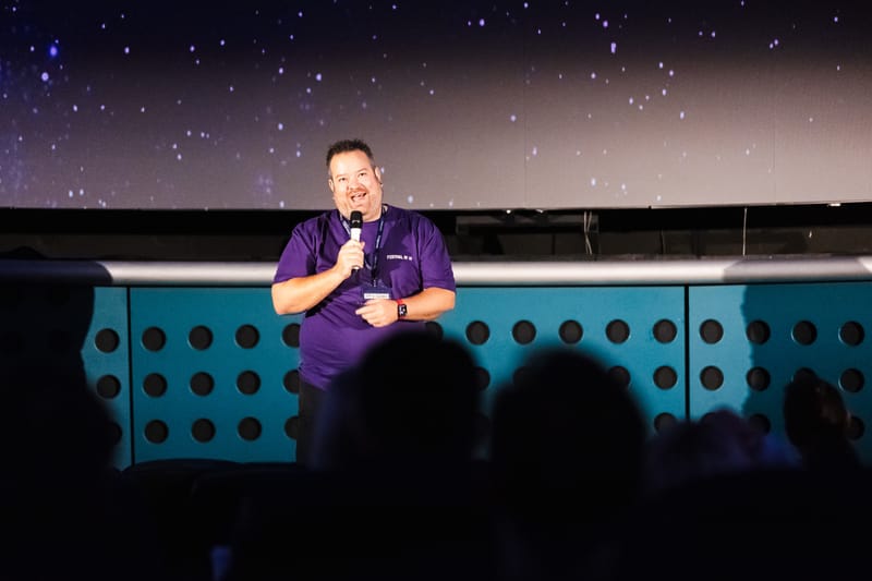Matthew Hughes opening Festival of AI 2026 on the Planetarium stage